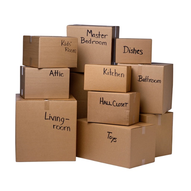 Moving boxes labeled by room after professional packing
