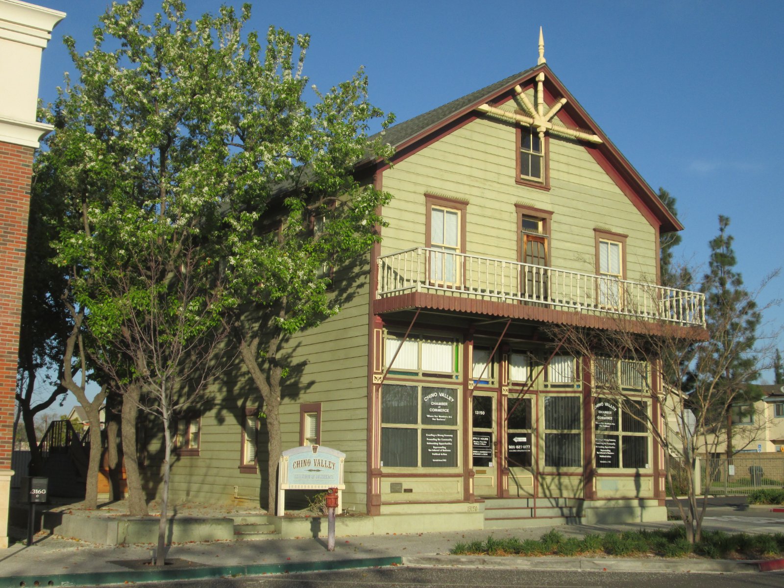 Historic Moyse Building on a downtown street in Chino, California, where California Movers USA checks curb space and doorway access before a move