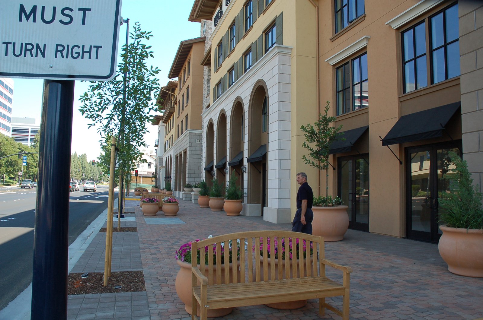Sidewalk and mixed-use buildings in downtown Concord, California, where Halo confirms the loading point and arrival window