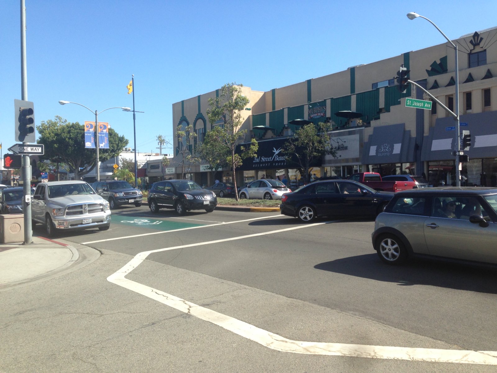 Downtown Long Beach, California street with traffic signals and curb lanes where Halo California Movers verifies the legal truck position before a move