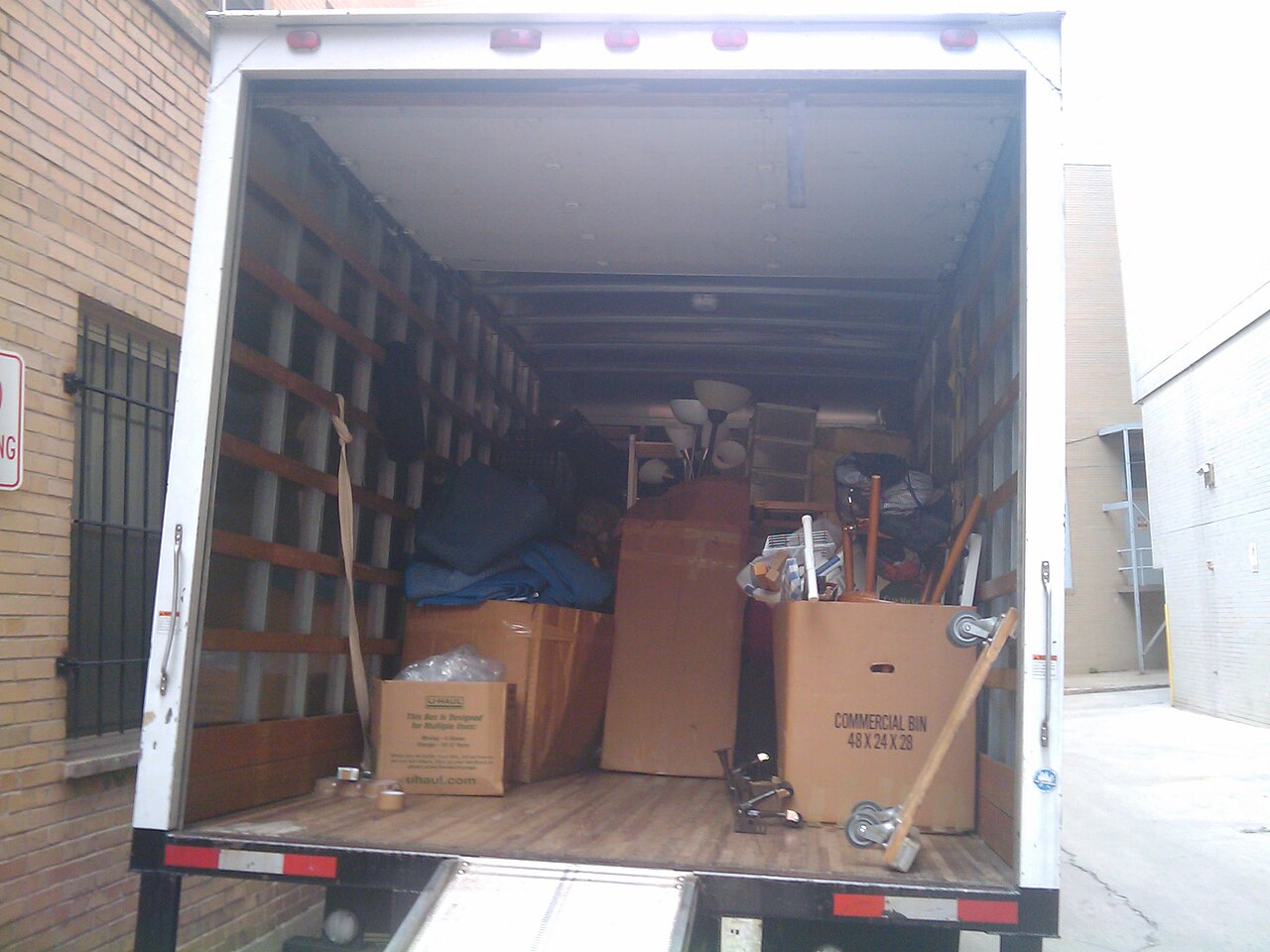 Cardboard moving boxes stacked and labelled before a relocation, the stage where most costly moving mistakes are made