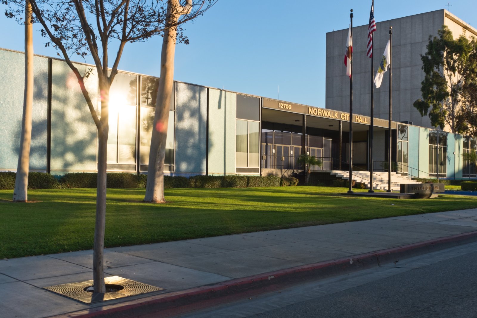 Norwalk City Hall in Norwalk, California, with the street and red curb in front, where Halo California Movers checks right-of-way rules before a move