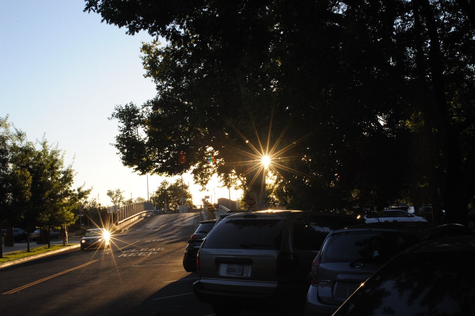 O Street in downtown Sacramento, California, looking west past parked cars and street trees