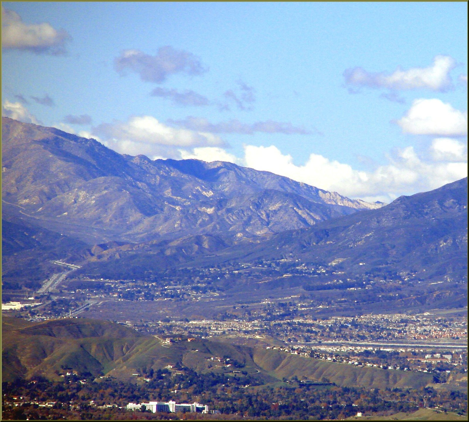 View northwest from Redlands toward the freeways climbing into Cajon Pass in San Bernardino County, California