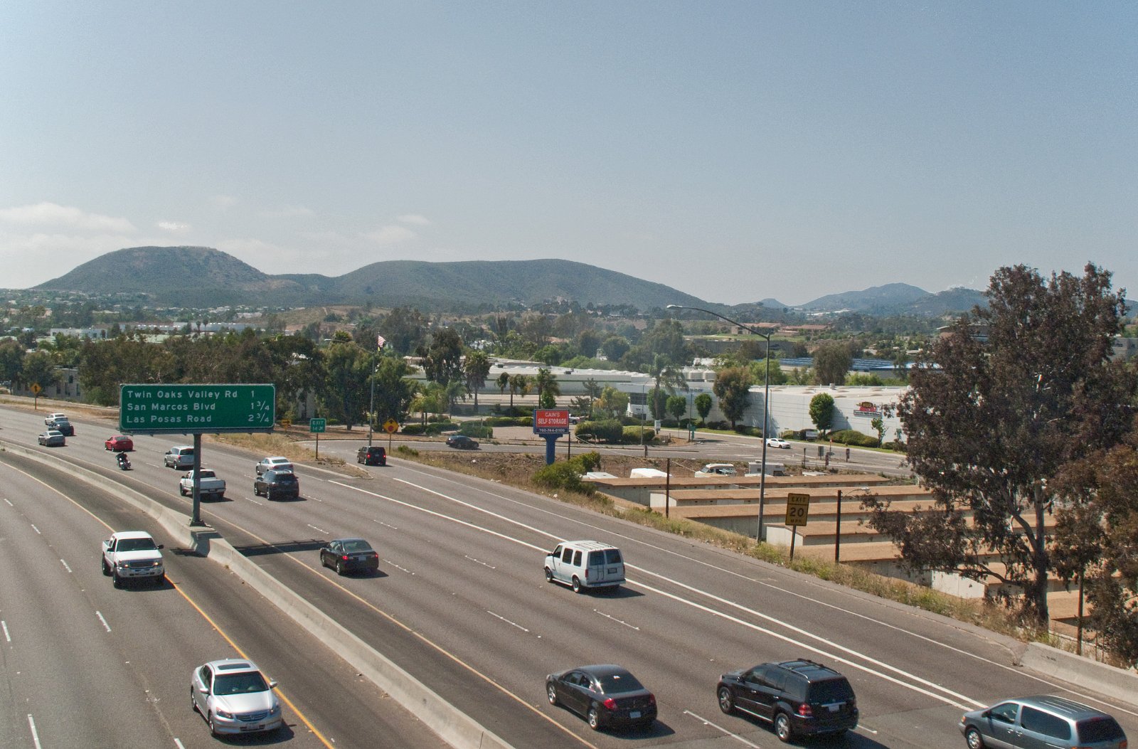 View west over State Route 78 running through San Marcos, California, with hills in the background