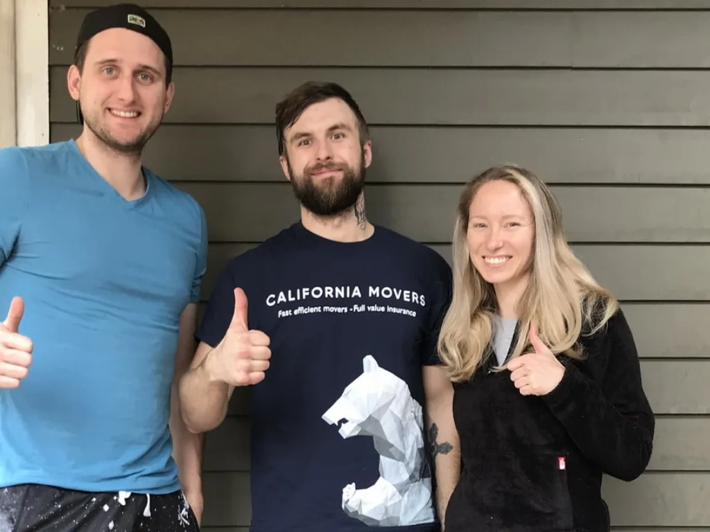 California Movers crew with a customer after a completed move