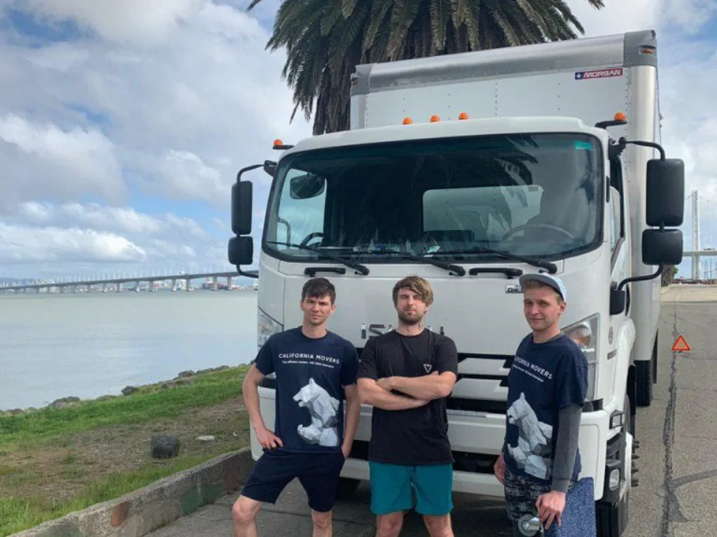 Moving team in front of the company truck